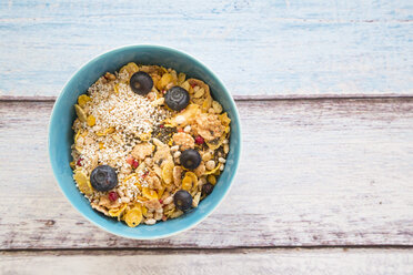 Organic chia seeds and popped amaranth, blueberries and glutenfree cereal in bowl - LVF002650