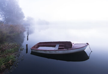 Morning Mist on the Lake and a lonely boat, Germany, Bavaria, Wesslinger See - MBOF000029