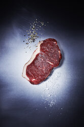 Raw striploin steak, salt and pepper - KSWF001361