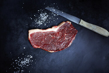 Raw striploin steak, salt and knife - KSWF001371