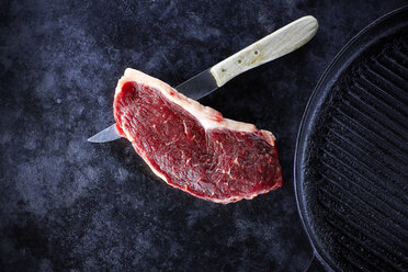 Raw striploin steak, knife and pan - KSWF001374