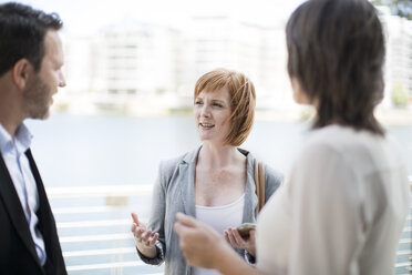 Business colleagues meeting outside the office - ZEF003826