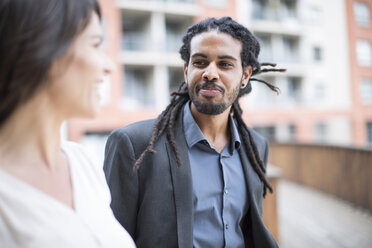 Businessman and woman having a break, talking - ZEF003816