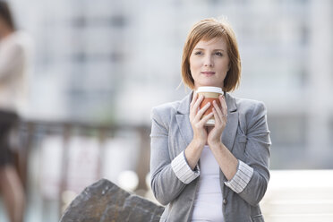 Businesswoman taking a break, drinking coffee - ZEF003863