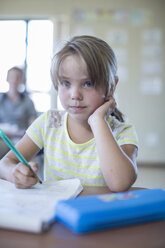 Portrait of primary schoolgirl in classroom - ZEF004982