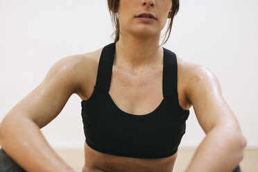 Sweating woman after fitness workout - EBSF000425