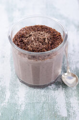 Glass of chocolate pudding with chia seeds sprinkled with chocolate shaving - ODF001082