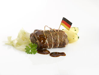 Beef roulade with potaoes and sauerkraut and German flag - KSWF001379