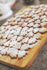 Home-baked Christmas cookies on wooden board - BZF000007