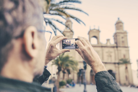 Spain, Canary Islands, Gran Canaria, Las Palmas, man taking picture of Catedral de Santa Ana stock photo