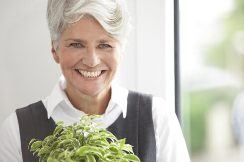 Portrait of smiling mature businesswoman - MFRF000013