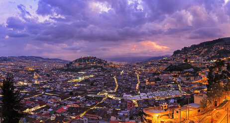 Ecuador, Quito, cityscape with El Panecillo at sunset - FOF007605