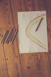 Sketch block and colored pencils on timber floor - LVF002727