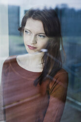 Young woman behind windowpane - UUF003228