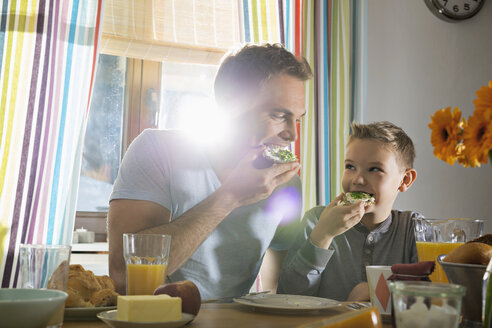 Father and son having breakfast together - PDF000752