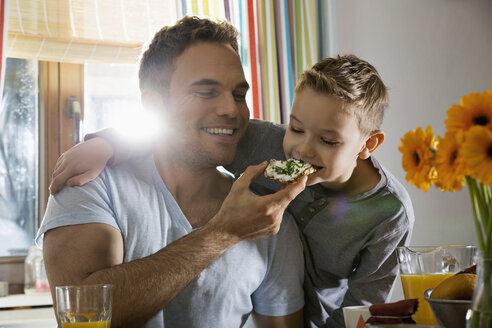 Father and son having breakfast together - PDF000753