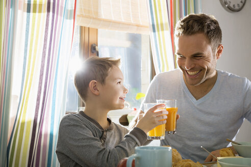 Father and son having breakfast together - PDF000736