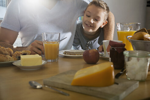 Father and son having breakfast together - PDF000732