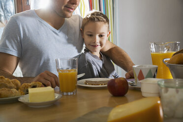 Father and son having breakfast together - PDF000731