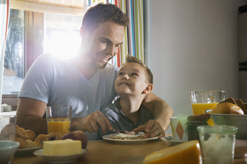 Father and son having breakfast together - PDF000730