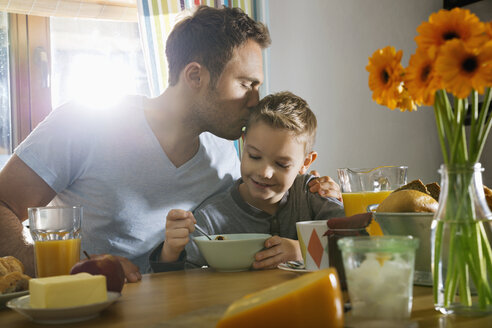 Father and son having breakfast together - PDF000729