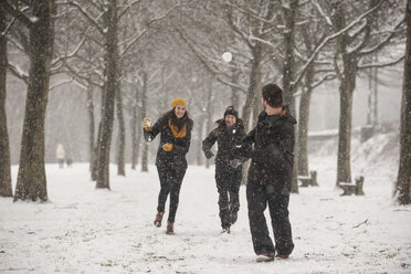 Three friends having a snowball fight - PAF001265