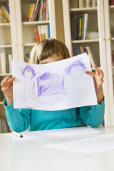 Little girl showing drawing - LVF002793