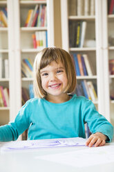 Portrait of smiling little girl with drawing - LVF002765