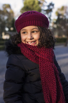Portrait of smiling little girl wearing wool cap and scarf - MGOF000059