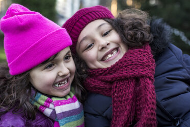 Portrait of two happy little girls in a park on a winter day - MGOF000066