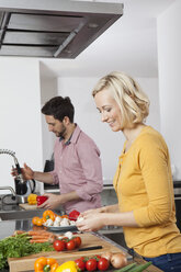 Couple cooking in kitchen - RBF002427