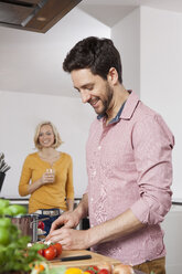 Couple cooking in kitchen - RBF002373