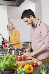 Couple cooking in kitchen - RBF002375