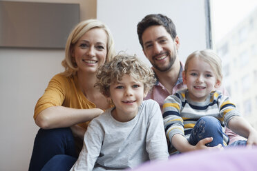 Portrait of happy family at the window - RBF002413