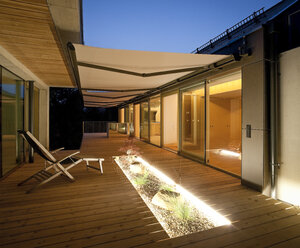 One family house, wooden terrace with awnings in the evening - DISF001167