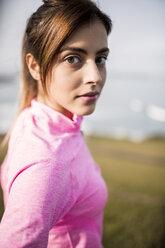 Spain, Gijon, portrait of brunette young woman outdoors - MGOF000086