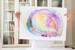 Little girl showing drawing painted with watercolours - LVF002797