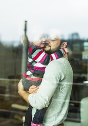 Father and daughter behind windowpane - UUF003371