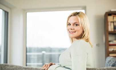 Portrait of smiling young woman at home - UUF003394