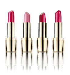 Row of four lipsticks in front of white background - RAMF000049