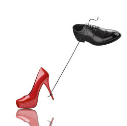 Black man's shoe and red high heel in front of white background - RAMF000053