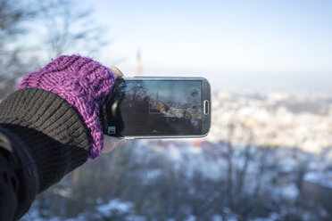 Germany, Bavaria, Landshut, woman taking cell phone picture - SARF001342