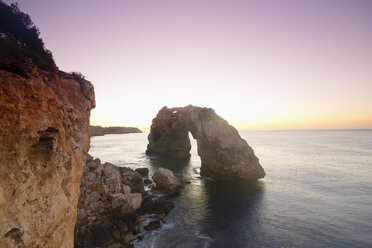 Spain, Mallorca, Es Pontas, stone arch at twilight - MEMF000715