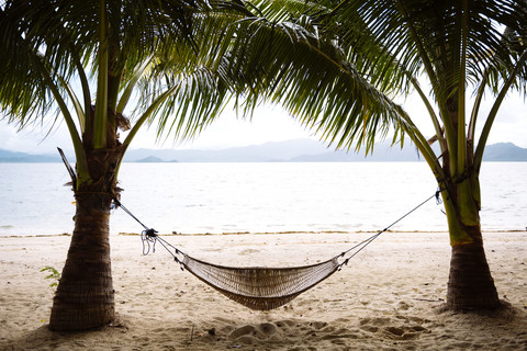 Philippines, Palawan, hammock and palms on a beach near El Nido stock photo