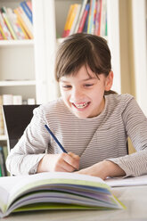 Portrait of smiling girl drawing something - LVF002881