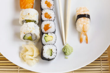 Variety of sushi with wasabi and ginger on plate - JTF000641