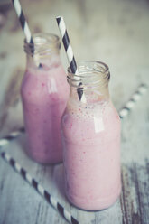Two glasses of banana strawberry smoothie - SARF001386