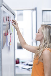 Creative office woman at a whiteboard - ZEF003065