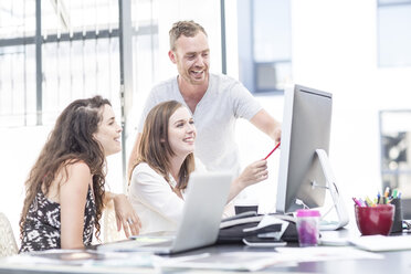 Creative office people having a discussion on a computer - ZEF003075