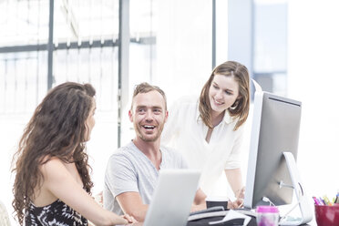 Creative office people having a discussion on a computer - ZEF003077